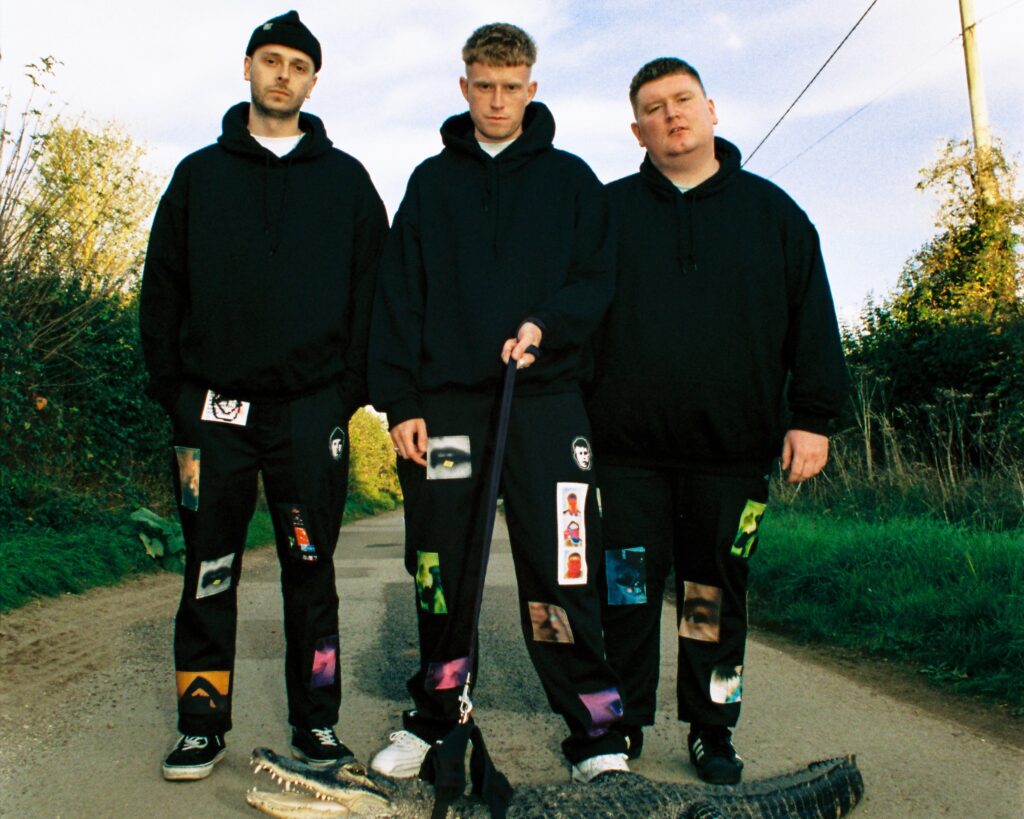 3 piece group NOISY stand in the middle of the road looking aggressive